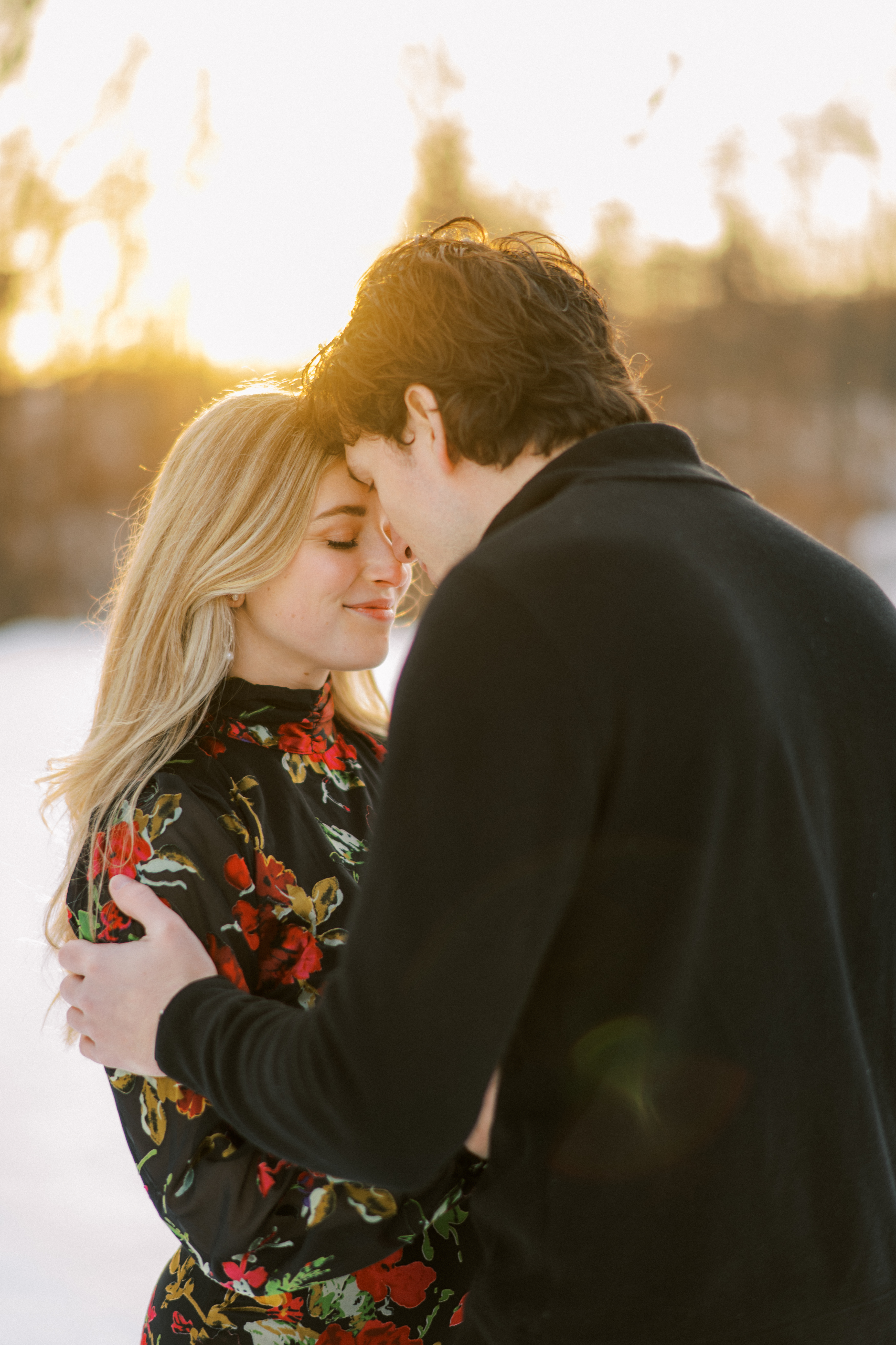 Foreheads touching in golden light