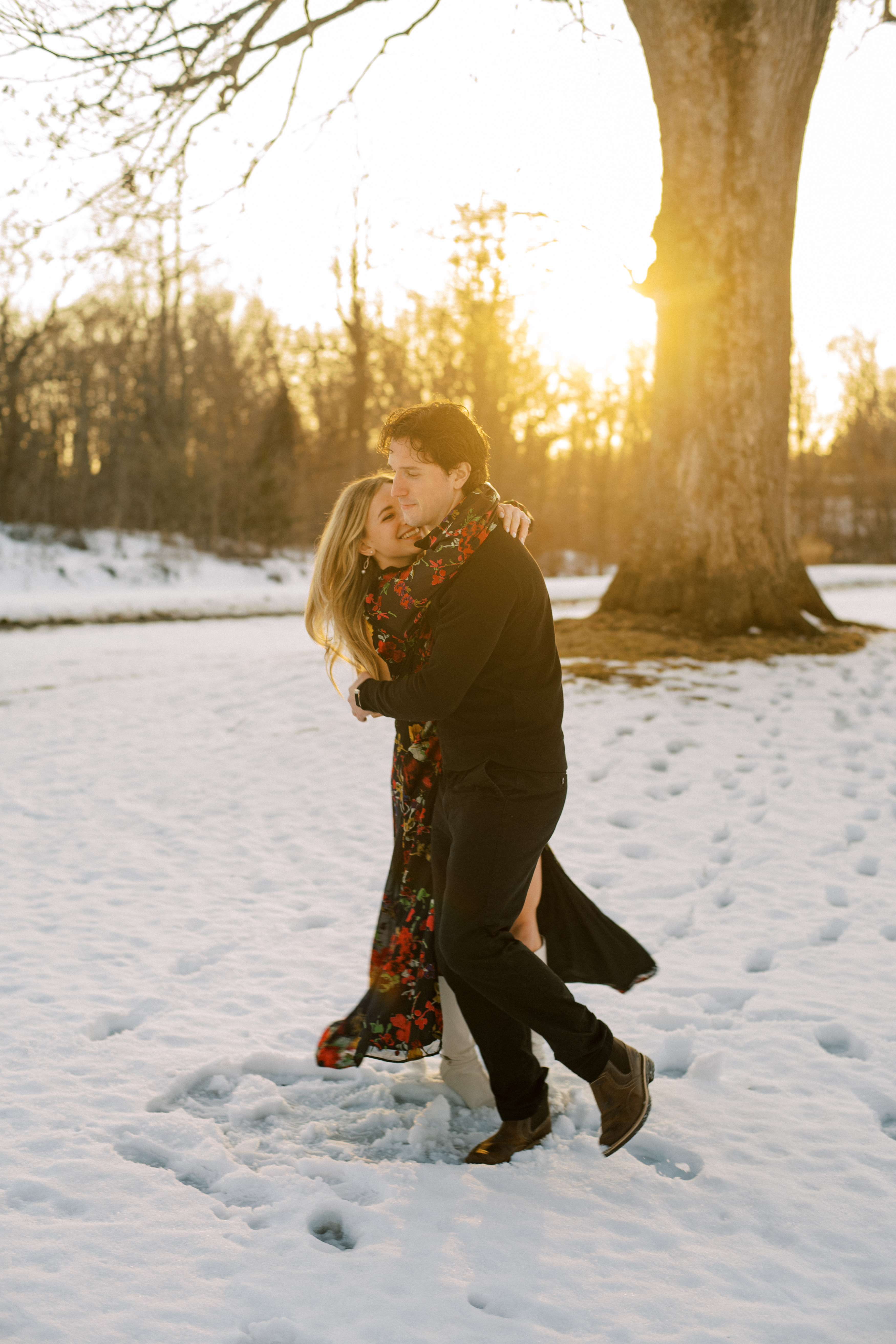 Emmett and Riley embracing in golden light